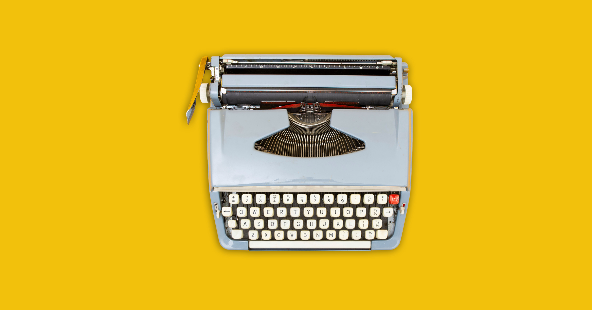 A vintage gray typewriter with white keys is centered on a bright yellow background, photographed from above—perfect for content creation or an inspiring B2B case study visual.