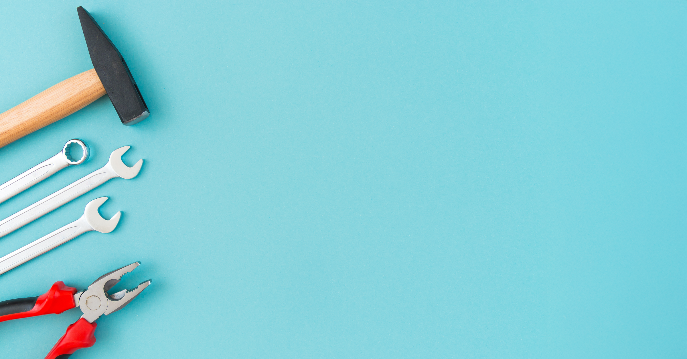 A hammer, two spanners, a wrench, and pliers with red handles are arranged in a row on the left side of a light blue background—reminding you not to keep wasting great case studies by leaving your tools unused.