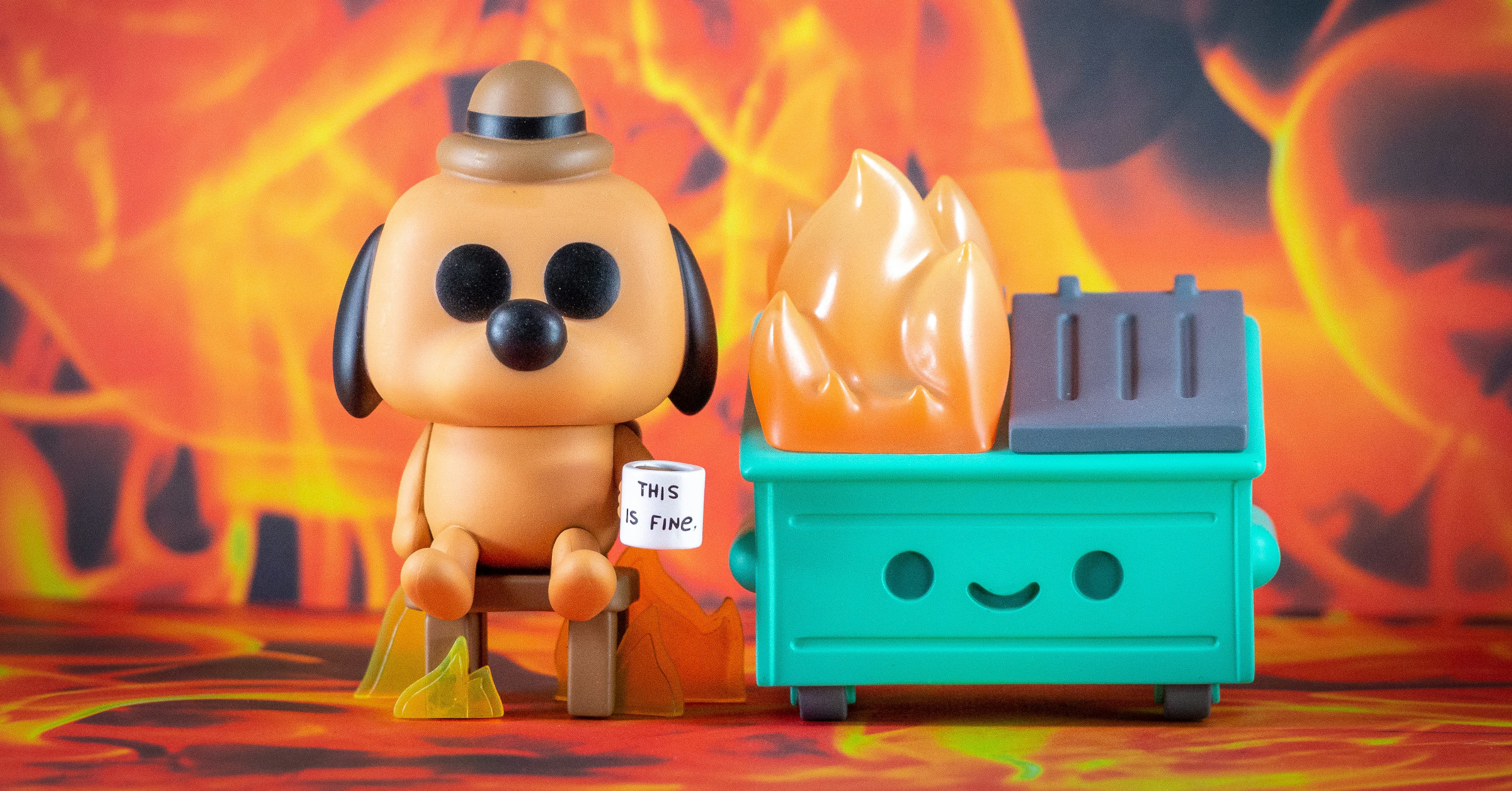 A toy dog wearing a hat sits calmly on a chair holding a "This is fine" sign, next to a smiling dumpster with cartoon flames—an imitation of viral memes, all set against a fiery background.